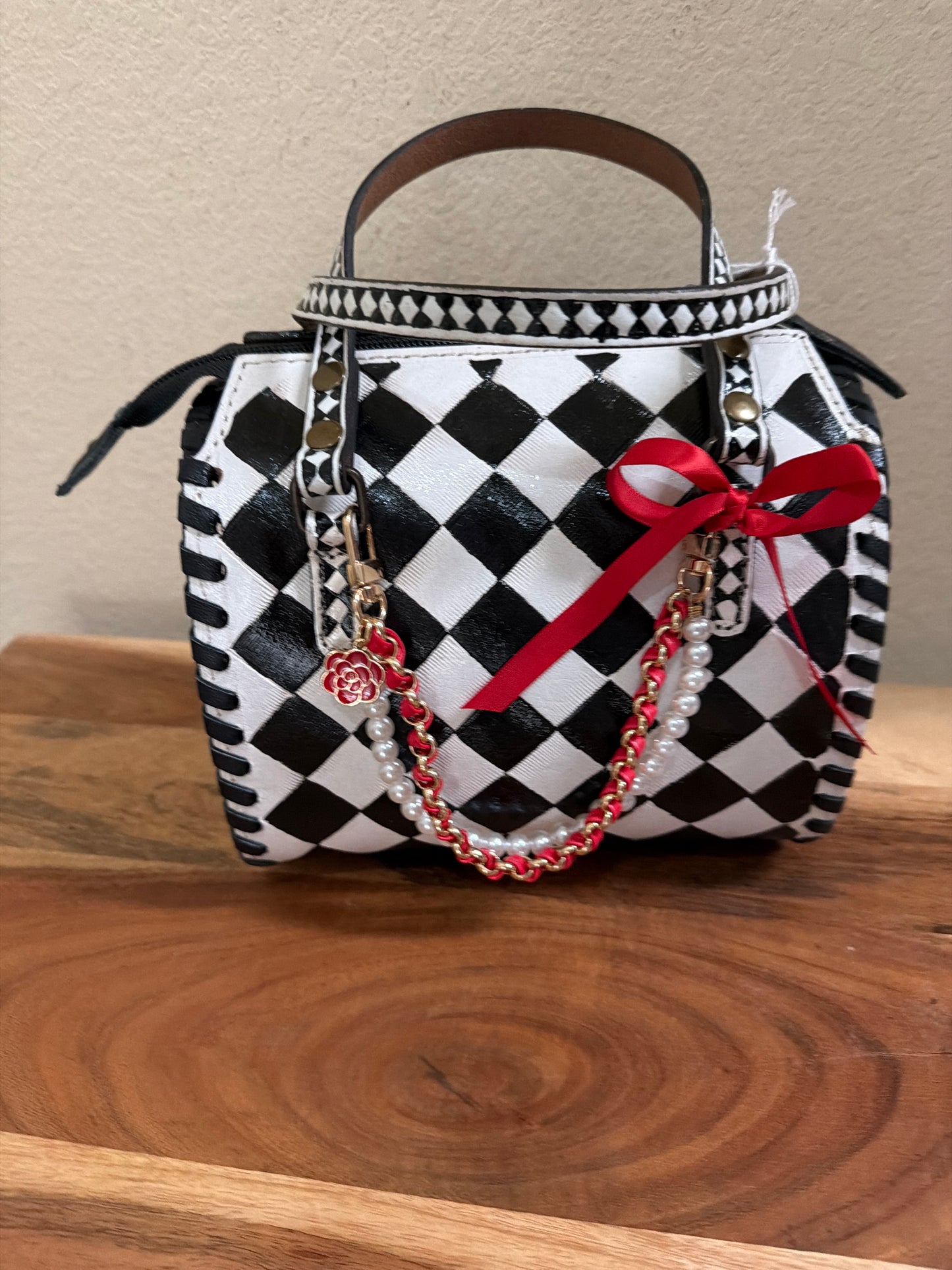 Small speedy black and white checked bag.