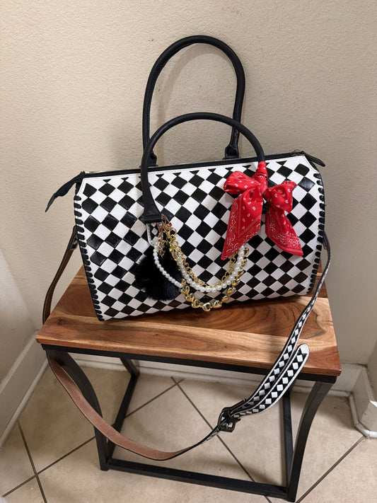 Large speedy black and white checked bag.